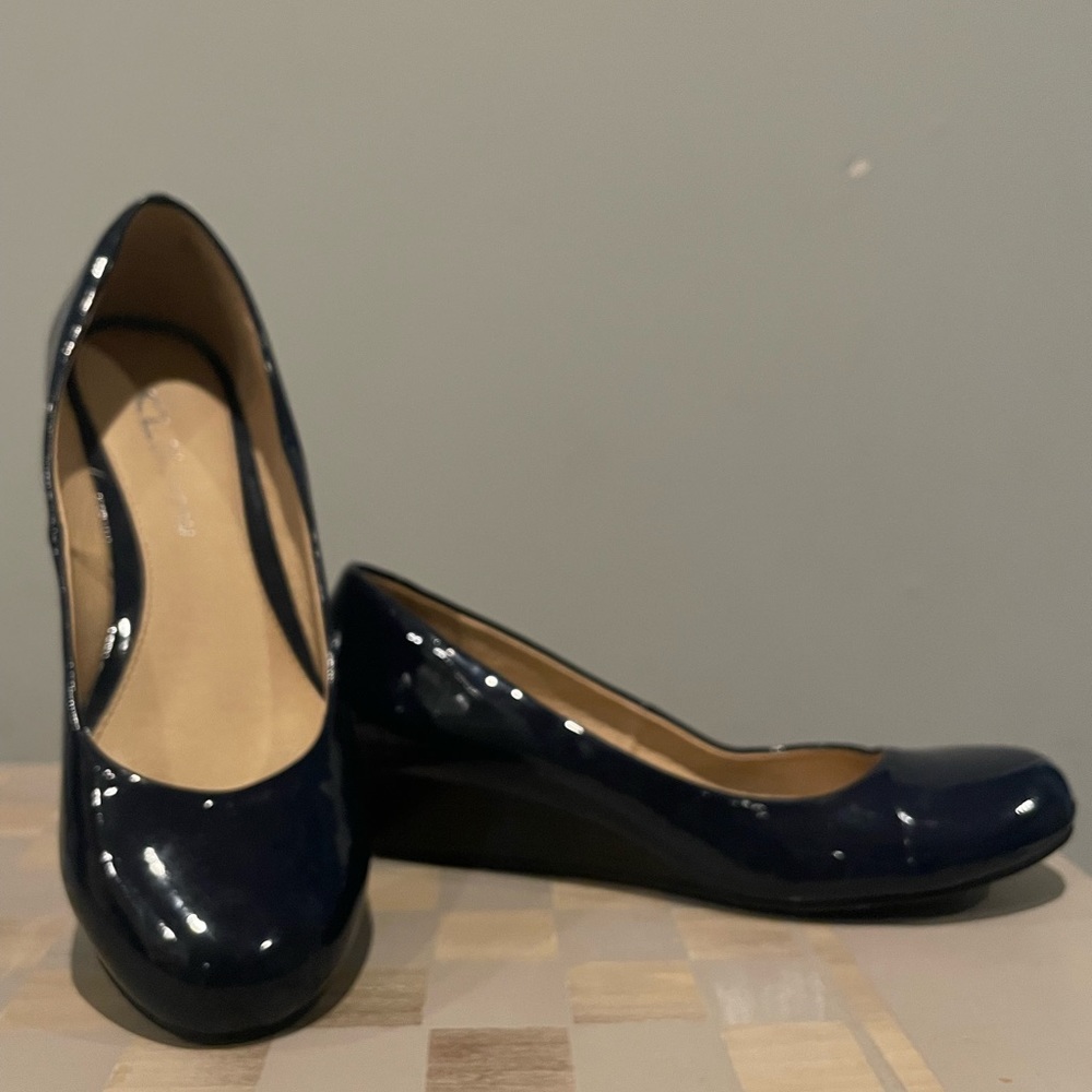 Navy blue patent leather wedges.